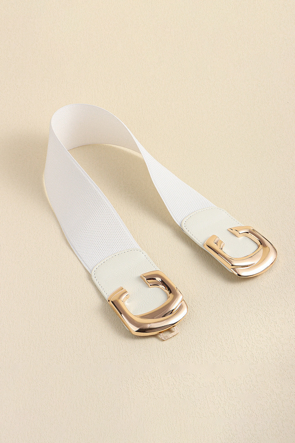 White waist belt opened to show both metal buckle pieces.