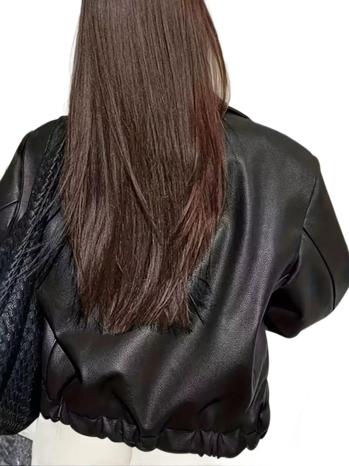 Back view of the black faux leather jacket showing its gathered lower hem.