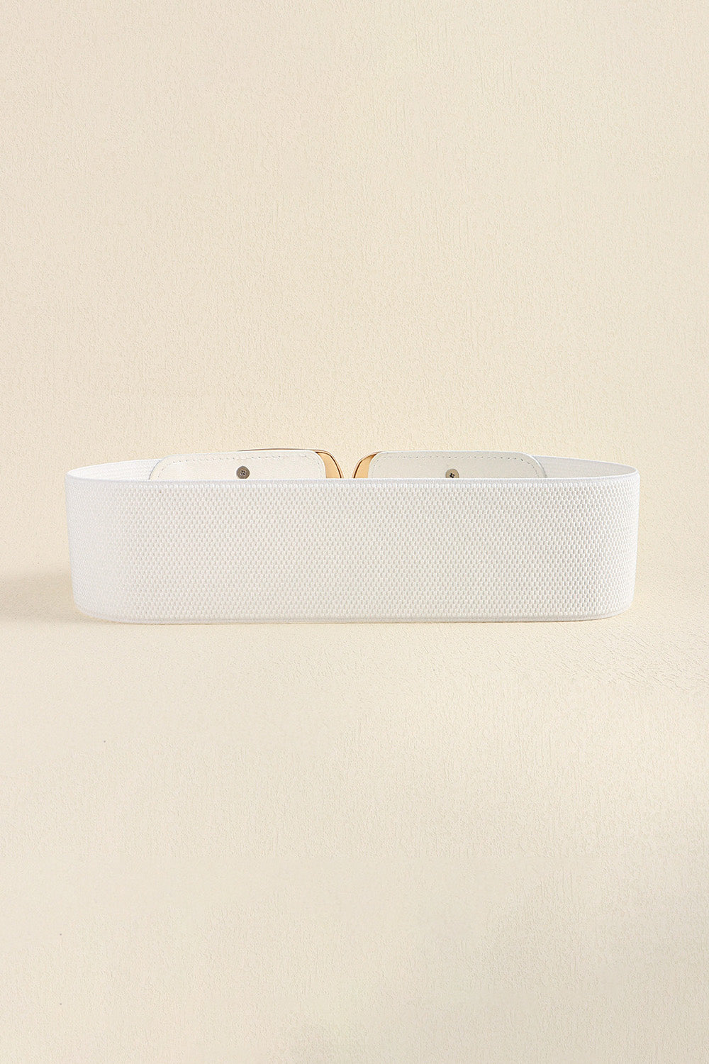Back view of the white belt showing the wide elastic band.