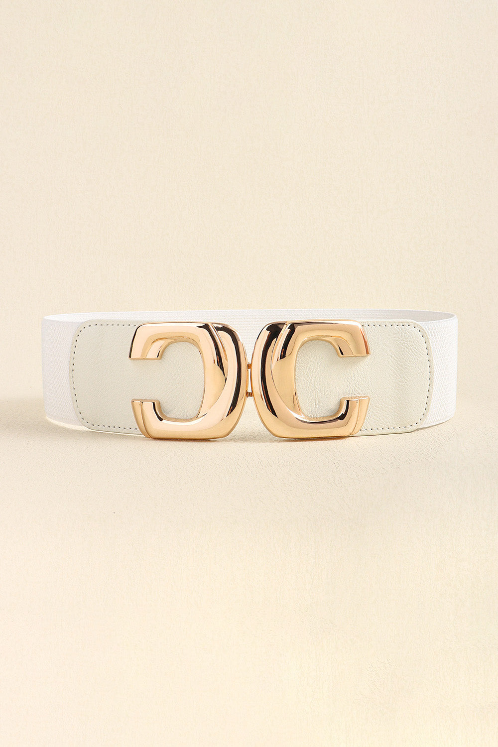 Front view of the white elastic waist belt with the metal buckle fastened.