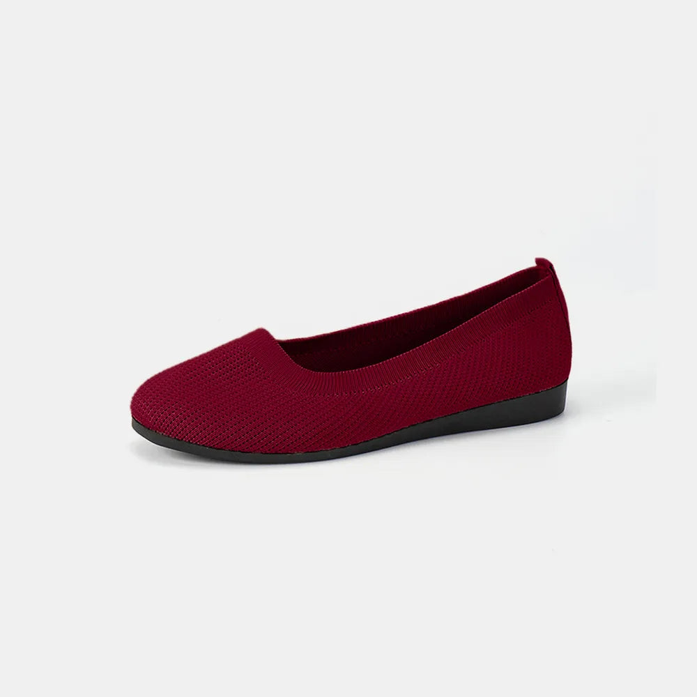 Burgundy knit ballet flat shown from the side on a plain background.