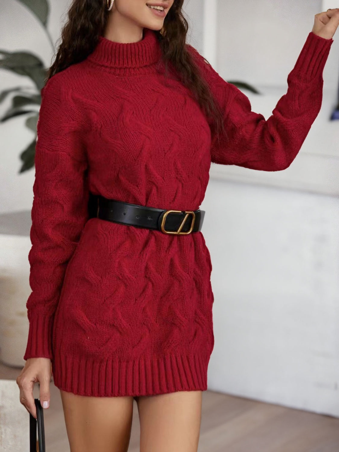Burgundy cable-knit turtleneck mini sweater dress shown from the front.
