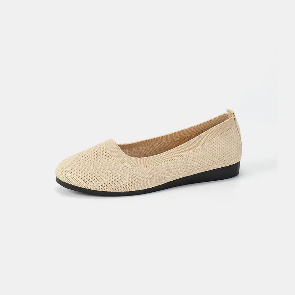 Ivory knit ballet flat shown from the side on a plain background.