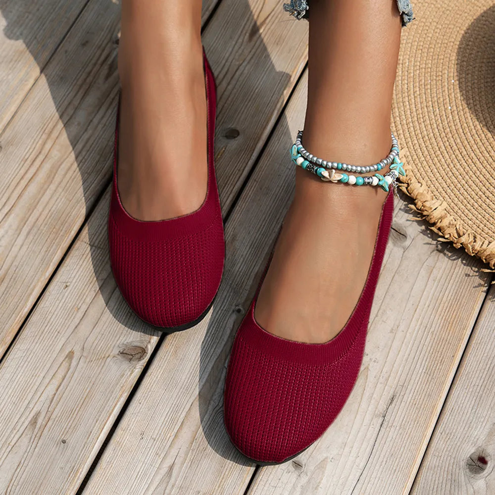 Top view of burgundy knit ballet flats showing the ribbed toe texture.