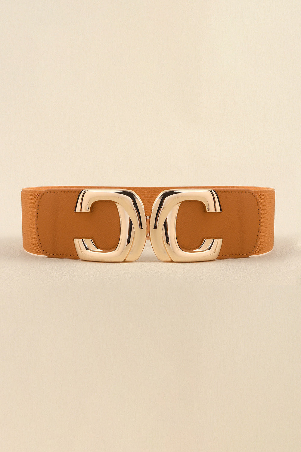 Front view of the caramel elastic waist belt with the metal buckle fastened.