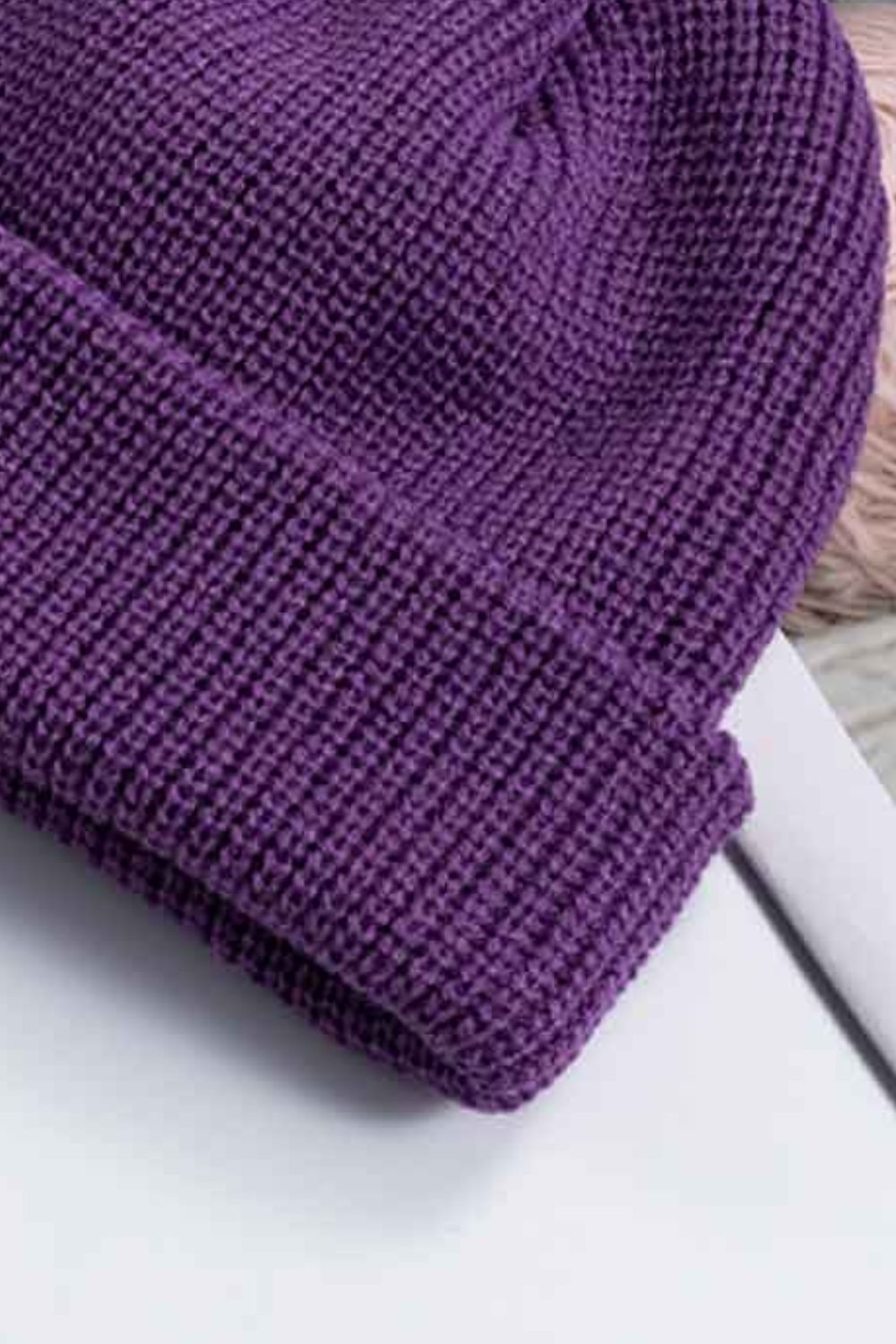 Close-up of the purple beanie's crown and folded cuff.